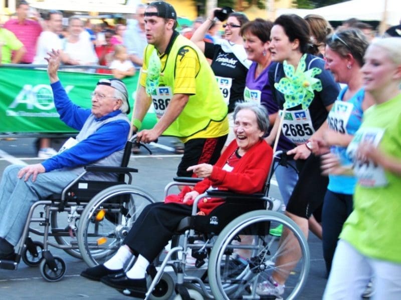 Health - seniors in wheelchairs in a community race
