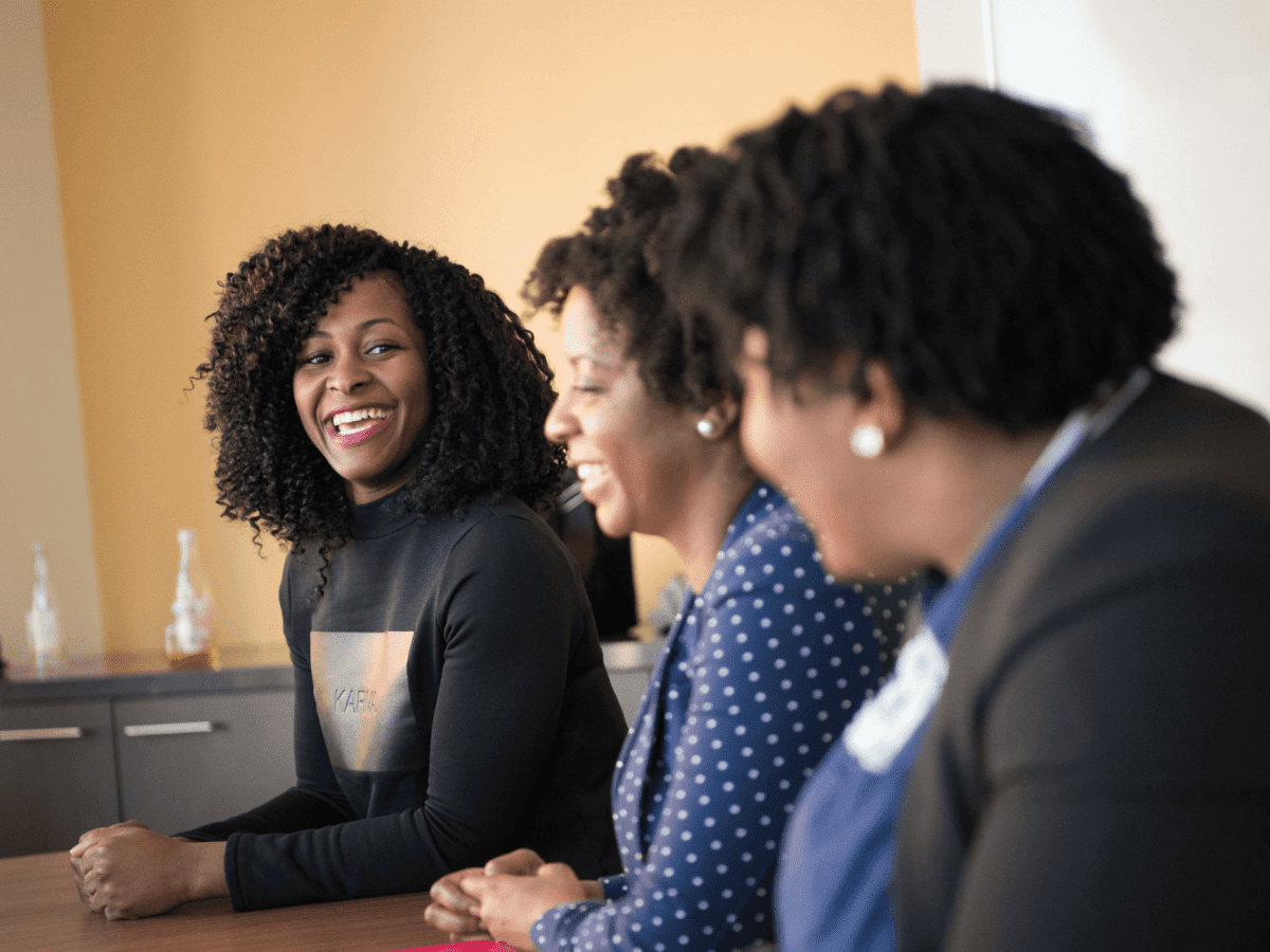 racialized women in a meeting